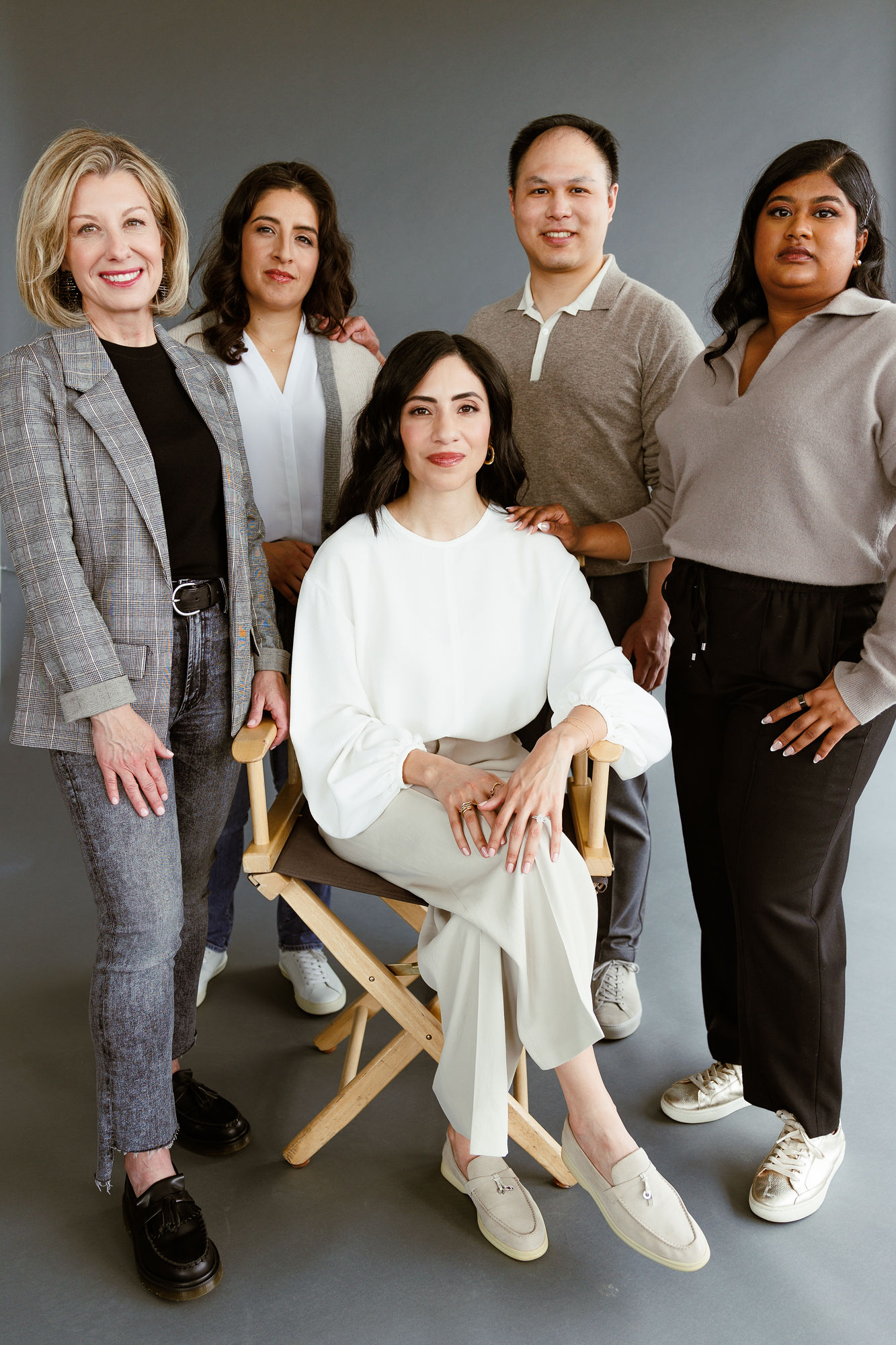 An executive woman in a tailored navy blazer, quiet confidence